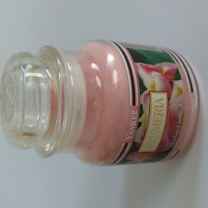 YANKEE CANDLE - black band- retired PLUMERIA- 3.7oz- never used.